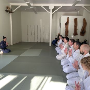 Maru Dojo - Sitting seiza, a Japanese way of sitting on the mat, while performing wrist warm ups. - Martial Arts Near Me - San Francisco, California Maru Dojo - Sitting seiza, a Japanese way of sitting on the mat, while performing wrist warm ups. - Martial Arts Near Me - San Francisco, California