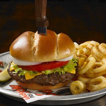 Hooters - a hamburger and fries on a plate - Sports Bars Near Me - Lakeland, Florida
