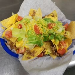 Bobs Pizza Place - Our Beef Nachos are served on chips fried in-house, tasty taco meat, gooey nacho cheese with fresh lettuce and tomato.
