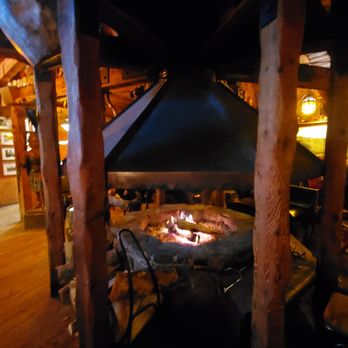 The Mill Steaks & Spirits - Fire going in the center of the bar. - Sports Bars Near Me - McCall, Idaho