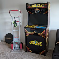 Sunbelt Rentals  - Electric stair-climbing hand truck (left) rented from Sunbelt to get arcade cabinet (right) upstairs