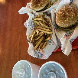 Two Quarter pound burgers with fires and soda