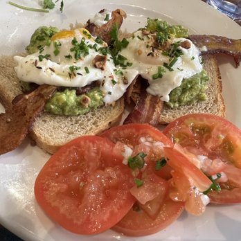 Cafe Pasqual's - Poached eggs on avacado toast with a side of tomatoes - Vegetarian Near Me - Santa Fe, New Mexico