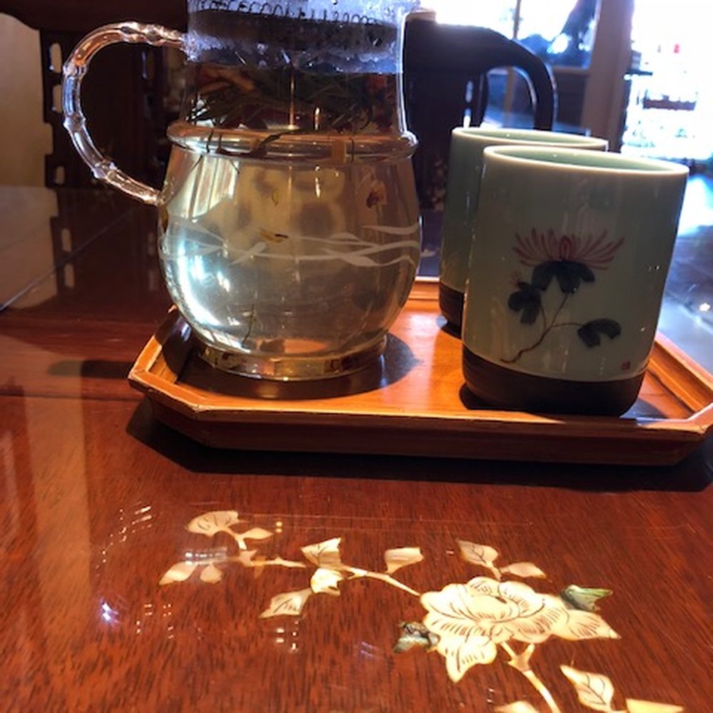 Tea service for two. Table inlay in the foreground. Tea service for two. Table inlay in the foreground.