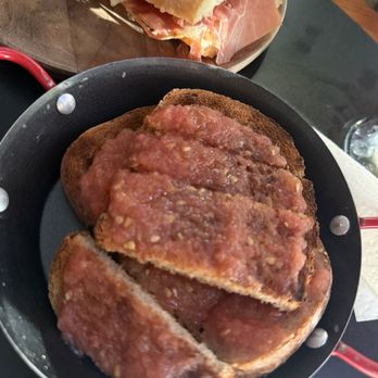 Austhentico - Sourdough rye with tomato spread - Spanish Near Me - Austin, Texas Austhentico - Sourdough rye with tomato spread - Spanish Near Me - Austin, Texas
