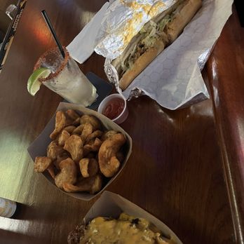Frazier's Long and Low - Chili dog, side of fries and chopped cheese - Bars Near Me - Austin, Texas