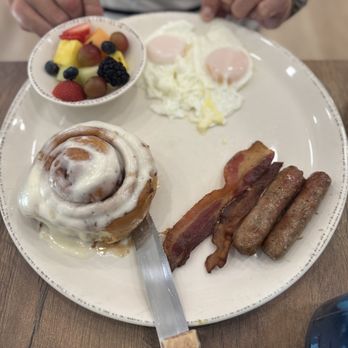 The Breakfast Company - Their ultimate special. Cinnamon bun eggs sausage bacon fresh fruit. My husband was thrilled they knew what " basted" eggs were. - Coffee & Tea Near Me - Sarasota, Florida The Breakfast Company - Their ultimate special. Cinnamon bun eggs sausage bacon fresh fruit. My husband was thrilled they knew what " basted" eggs were. - Coffee & Tea Near Me - Sarasota, Florida