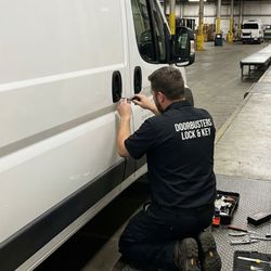 Doorbusters Lock & Key - Doorbusters Lock & Key technician unlocking a commercial van using professional automotive locksmith tools.