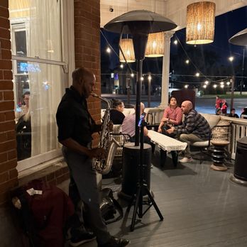 LATHA - Outdoor dining with a saxophone player - African Near Me - Phoenix, Arizona