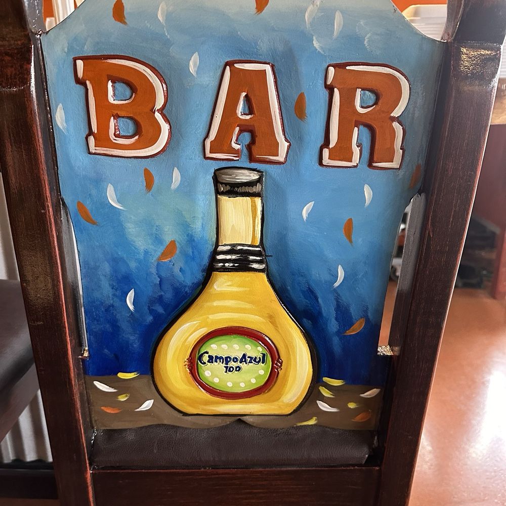 Los Patio’s - a bar sign on a chair - New Mexican Cuisine Near Me - Brownsburg, Indiana Los Patio’s - a bar sign on a chair - New Mexican Cuisine Near Me - Brownsburg, Indiana
