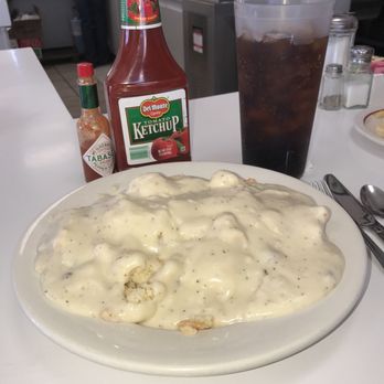 Carla's Cafe - Two biscuits & gravy, with a regular sized soda. Both are huge!! - Diners Near Me - Bakersfield, California