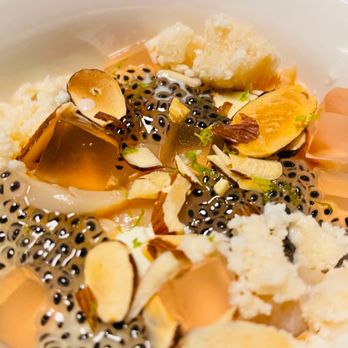 Sunday Vinyl - a bowl of food with rice and fruit - Wine Bars Near Me - Denver, Colorado