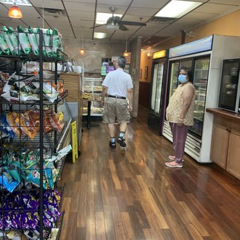 The Bagel Place - a man and a woman shopping in a grocery store - Bagels Near Me - Plainsboro, New Jersey The Bagel Place - a man and a woman shopping in a grocery store - Bagels Near Me - Plainsboro, New Jersey