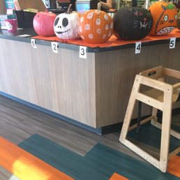 a counter with pumpkins on it