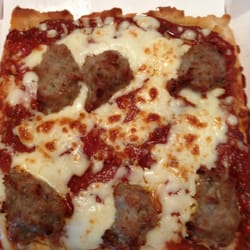 Rocky Rococo Pan Style Pizza - Sausage and pepperoni super slice.