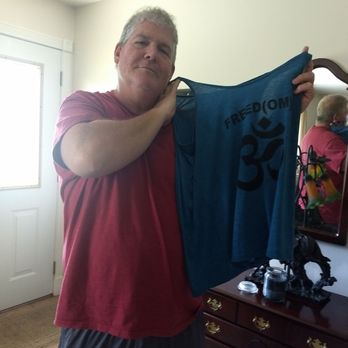 Peace Yoga - Holding up my new Peace Yoga shirt. Best yoga studio ever.... - Yoga Near Me - Fallston, Maryland