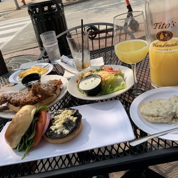The Phoenix - a plate of food and a glass of orange juice - New American Near Me - Kansas City, Missouri