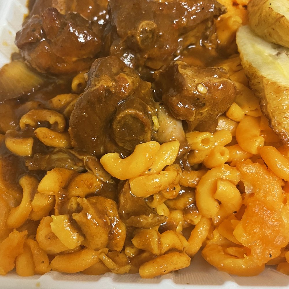 Orange Mac and cheese. Brown stew chicken has bbq sauce in the gravy.