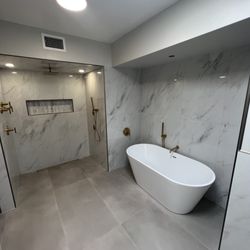 M Goldman General Maintenance - Pedestal tub with roll in shower