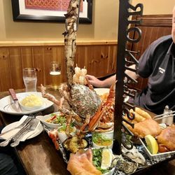 Caisleain Oir - The group let me take this pic. I would have ordered if I weren't solo. Surf & Turf w/ tomahawk steak, Dungeness crab, etc.. a beauty.