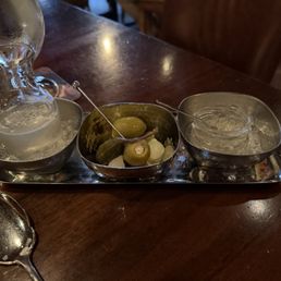 Martini service in addition to the martini: extra martini, garnishes, brine "caviar"