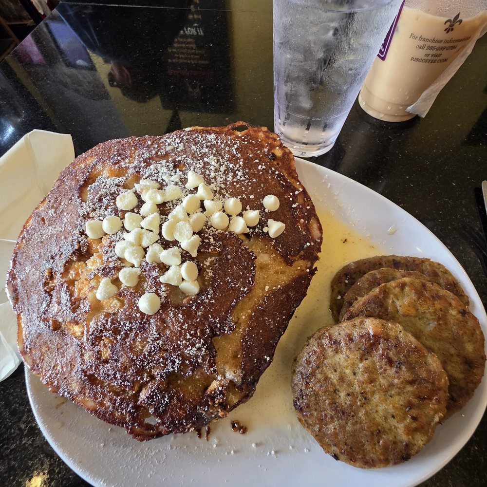 Ruby Slipper Decatur - White chocolate bread pudding pancakes with a side of chicken sausage patties - Breakfast & Brunch Near Me - New Orleans, Louisiana Ruby Slipper Decatur - White chocolate bread pudding pancakes with a side of chicken sausage patties - Breakfast & Brunch Near Me - New Orleans, Louisiana