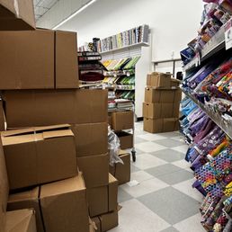 Near the fabric. Aisle so narrow that you couldn't really look at the fabric without bumping into something.