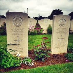 Cimetière Militaire Britannique de Bayeux - Each grave has the badge of the regiment that soldier was part of. Creating some individuality which I find endearing.