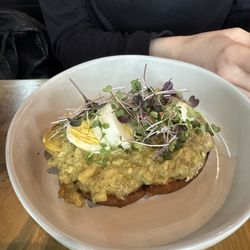 Avocado toast for the people. Pro tip get a side of toast because it's a lot of avocado goodness.