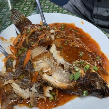 Spicy Thai Lao - Half eaten fried whole fish with tamarind sauce. Delicious - Thai Near Me - Burbank, Illinois Spicy Thai Lao - Half eaten fried whole fish with tamarind sauce. Delicious - Thai Near Me - Burbank, Illinois