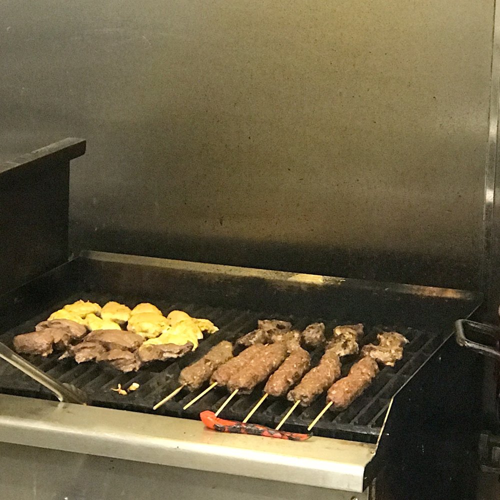 Nour Cafe - a grill with a variety of food on it - Falafel Near Me - Revere, Massachusetts Nour Cafe - a grill with a variety of food on it - Falafel Near Me - Revere, Massachusetts