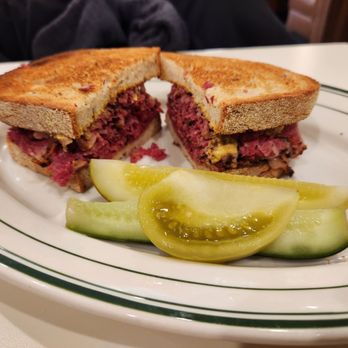 Mensch's Deli - Pastrami on toasted rye, pickles and pikled tomato. - Delis Near Me - Evanston, Illinois