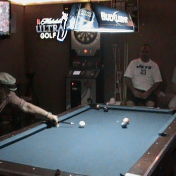 Chubby Buddha - a man playing pool in a bar - Sports Bars Near Me - Shallotte, North Carolina Chubby Buddha - a man playing pool in a bar - Sports Bars Near Me - Shallotte, North Carolina