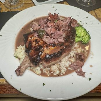 Basso Cucina Italiana - "Pork Chop Di Parma" (juicy 12-oz. pork chop topped with prosciutto and red wine demi-glaze served over risotto) - Italian Near Me - Cresco, Pennsylvania Basso Cucina Italiana - "Pork Chop Di Parma" (juicy 12-oz. pork chop topped with prosciutto and red wine demi-glaze served over risotto) - Italian Near Me - Cresco, Pennsylvania
