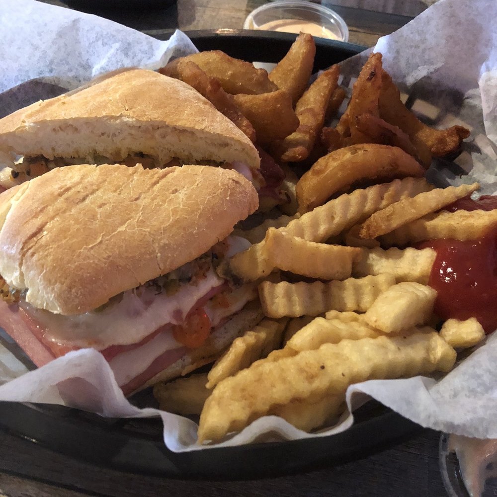 Drunken Mullet - Muffuletta with onion petals and great fries!!! Dinner for tonight we were so full at lunch - Sports Bars Near Me - Hernando Beach, Florida Drunken Mullet - Muffuletta with onion petals and great fries!!! Dinner for tonight we were so full at lunch - Sports Bars Near Me - Hernando Beach, Florida