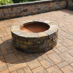 Lawns & Beyond Landscaping - An outdoor fire pit is a great addition to your custom stone patio.