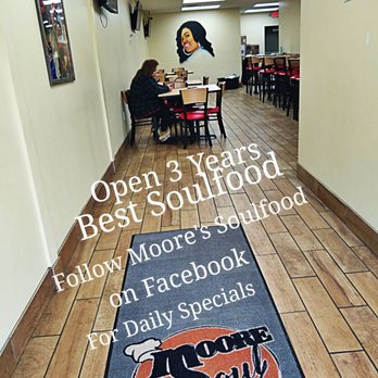 Moore Soulfood - a woman sitting at a table in a restaurant - Soul Food Near Me - Detroit, Michigan Moore Soulfood - a woman sitting at a table in a restaurant - Soul Food Near Me - Detroit, Michigan