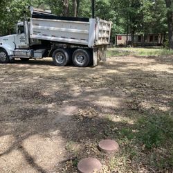 A & M Sand & Gravel - Dumping one of several loads of select fill for a mobile home pad
