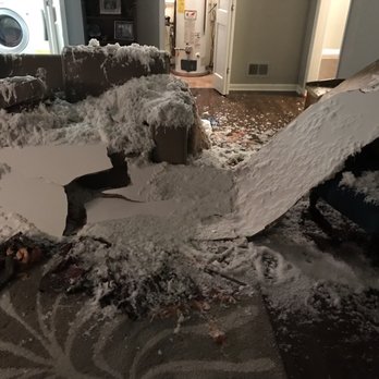 ProDry Restoration - Before Mike and his team arrived...2" of water on the ground in addition to insulation and water pouring everywhere. - Damage Restoration Near Me - Wheaton, Illinois