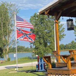 New London Reservoir Campground - A campsite flying a US flag, and a traitor flag with a rifle silhouette that reads "come and take it".