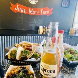 mexican food and a bottle of beer mexican food and a bottle of beer