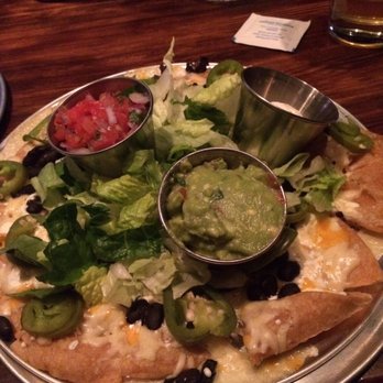 The Moonlighter - Nachos. Solid & the pickled jalapeños have a nice kick. A tad pricey for 12 individual nachos ($12) - Burgers Near Me - Chicago, Illinois The Moonlighter - Nachos. Solid & the pickled jalapeños have a nice kick. A tad pricey for 12 individual nachos ($12) - Burgers Near Me - Chicago, Illinois