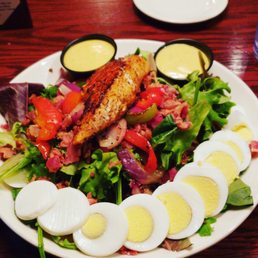 a plate of salad with hard boiled eggs a plate of salad with hard boiled eggs
