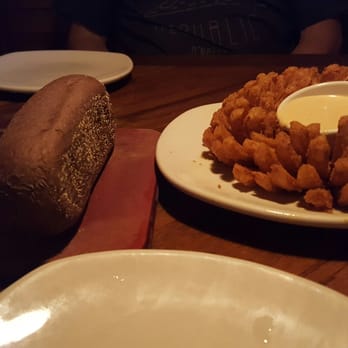 Outback Steakhouse - Bloomin onion (a little oily, but yummy) and free bread - Steakhouses Near Me - Ontario, California Outback Steakhouse - Bloomin onion (a little oily, but yummy) and free bread - Steakhouses Near Me - Ontario, California