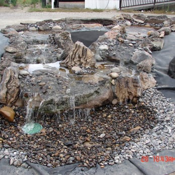 Rainy Day - Notice we used some petrified wood pieces which were provided by the customer. - Landscaping Near Me - Caldwell, Idaho Rainy Day - Notice we used some petrified wood pieces which were provided by the customer. - Landscaping Near Me - Caldwell, Idaho