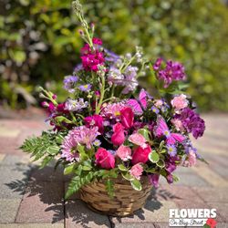 Beautiful Basket full of fresh-cut flowers, Spring 2024