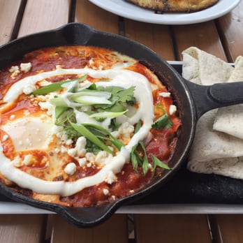 Eatery A - Fiery San Marzano Tomato with baked eggs and chickpeas - Mediterranean Near Me - Des Moines, Iowa Eatery A - Fiery San Marzano Tomato with baked eggs and chickpeas - Mediterranean Near Me - Des Moines, Iowa