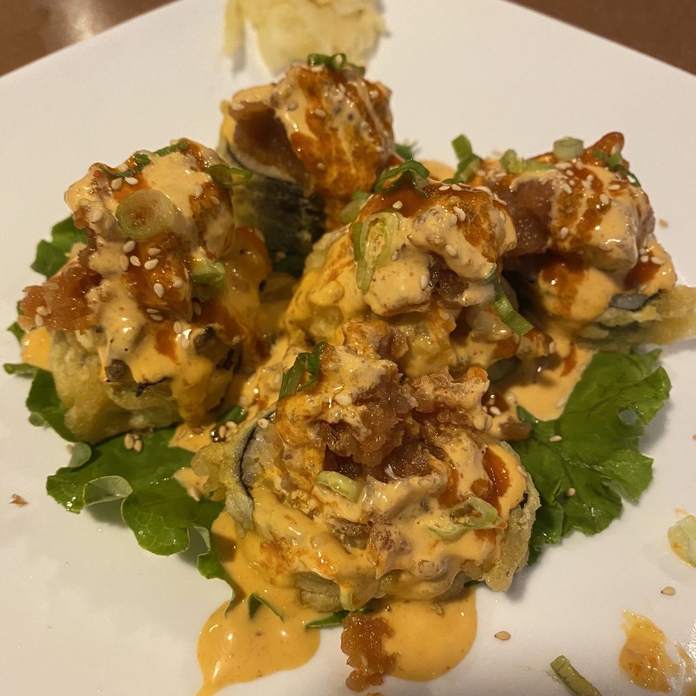 Sakura Bana - Volcano Roll. Deep fried Avocado and spicy dynamite Topped with spicy tuna, sesame seeds, and special hot sauce. It's GRRREATT - Japanese Near Me - Jackson, Mississippi Sakura Bana - Volcano Roll. Deep fried Avocado and spicy dynamite Topped with spicy tuna, sesame seeds, and special hot sauce. It's GRRREATT - Japanese Near Me - Jackson, Mississippi