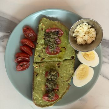 La Isla - pesto avocado toast with boiled eggs cheese and cherry tomatoes - Cafes Near Me - San Juan, Puerto Rico La Isla - pesto avocado toast with boiled eggs cheese and cherry tomatoes - Cafes Near Me - San Juan, Puerto Rico