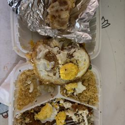 Chilaquiles with burnt egg and a scorched cheesy roll up thing. $19.85 plus 20% gratuity